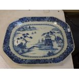A large Chinese blue and white export porcelain dish, canted rectangular, painted with a riverscape,