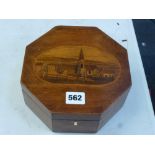 An early 19th century octagonal box, probably in fruitwood, inset with a marquetry panel of a