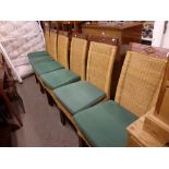 A set of six modern stylish dining chairs, in teak and wicker, with green squabs WE DO NOT ACCEPT