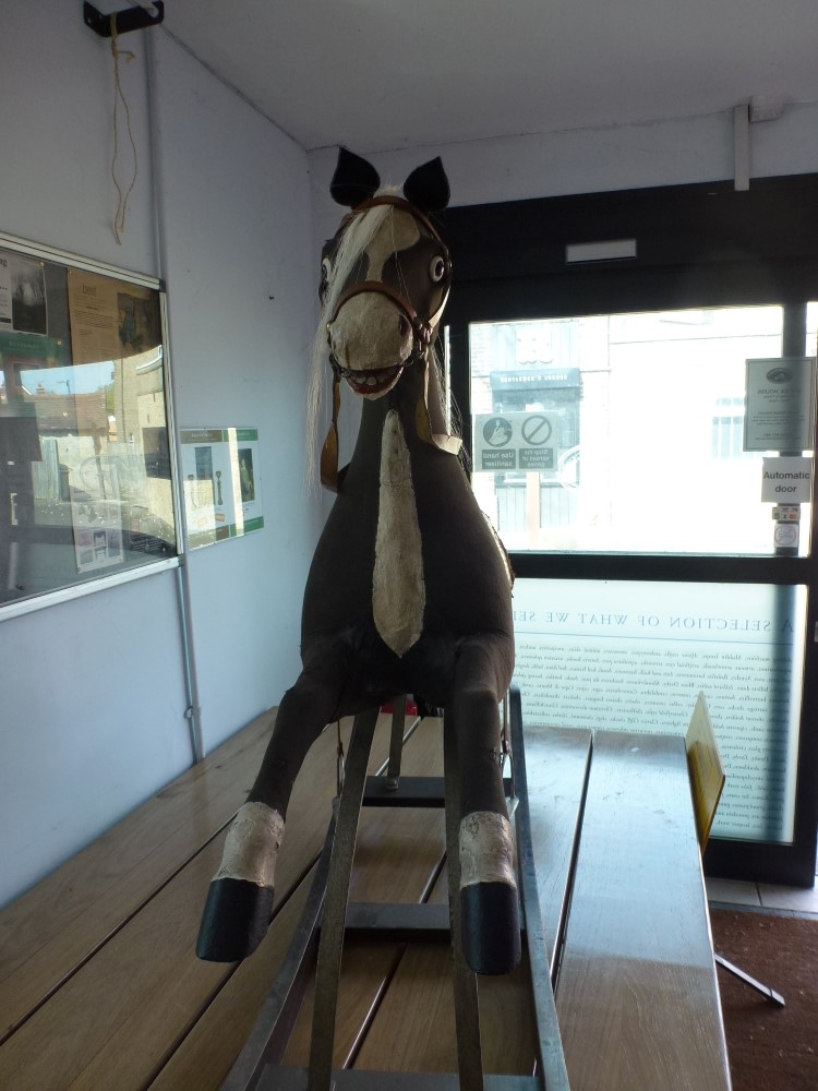 A 19th century and later 'Galloper' rocking horse,  black fabric over wood and stuffed body on - Image 2 of 2