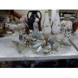Four Lladro figurines of girls in various farmyard settings including with five piglets, another