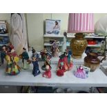 Nine Royal Doulton figures, comprising: an early Balloon Seller HN583 dated 3.12.27; Sweet and