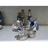 A collection of four B & G Copenhagen child figural pieces, together with a B & G sparrow group [