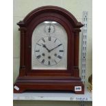 An early 20th century mahogany three-train mantel clock by Gustav Becker, quarter-chiming on rods,