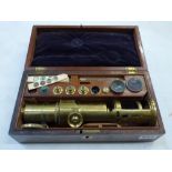 A Victorian monocular brass microscope with various accessories, in mahogany case [B] WE DO NOT