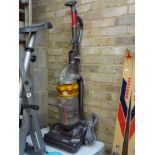 A Dyson vacuum cleaner [on lot 879] WE DO NOT ACCEPT CREDIT CARDS. STORAGE IS CHARGED AFTER THE