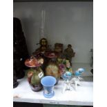 A pair of china budgerigars figurines, a large flower ornament, a pair of figurines of elderly