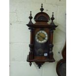 A late 19th century German wall timepiece with pendulum movement by W & E, in oak case, 26.5 cm