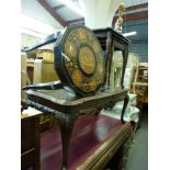 A pedestal desk of seven drawers with red leather top, an Edwardian cross-banded Sutherland table, a