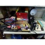 A mixed lot including a Tasser Command game, A Tomy Atomic Pinball game, an adjustable desk light, a