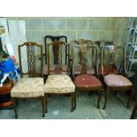 Early 20th century dining chairs comprising a set of four with carved and pierced backs, a pair with