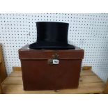 A Collins & Son, Winchester black top hat in tan carry case [upstairs wooden shelves] WE DO NOT