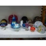 A quantity of glass paperweights including Caithness 'Daydreams', an owl, penguins and birds,