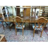 A good quality reproduction twin pillar mahogany dining table by Epstein, extending with a leaf,