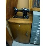 A Singer cabinet sewing machine and a Bisley metal filing cabinet of 12 shallow drawers. WE DO NOT