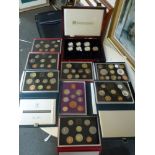 A collection of United Kingdom proof coin sets produced by the Royal Mint for 1970, 1986, 1987, 1989
