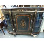 A Victorian ebonised credenza, the marquetry door flanked by bowed glazed doors with gilt-metal