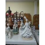 Six Lladro porcelain figures of young girls and one boy, including a girl seated with a vase of
