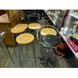 A pair of Italian designed bar stools on metal legs, a set of three bar chairs on chromed legs and