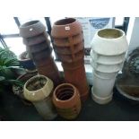 Two tall early 20th century terracotta chimneys plus another painted white and two smaller