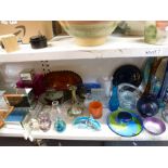 Two shelves of highly decorative glassware including two serving dishes decorated with poppies,