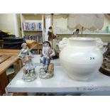 A pair of Continental figurines depicting an 18th century couple plus a large Poole Pottery magnolia