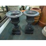 A pair of black classical design cast iron urns [hall] WE DO NOT ACCEPT CREDIT CARDS. CLEARANCE