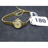 A Roamer 9 ct gold lady's wrist watch on integral brick-pattern bracelet, Birmingham 1961 and London