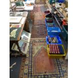 Five Eastern rugs, including an old probably Turkish prayer example and a kelim [in front of