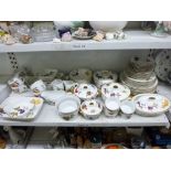 A shelf of Royal Worcester Evesham pattern tea and dinner wares including tureens and covers, cereal
