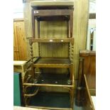 Two drinks trolleys, one with a bent bamboo frame and smoky glass shelves, the other in mahogany,