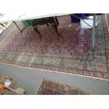 An old Eastern carpet, probably Mashad, 198 x 295 cm [in front of jewellery cabinet] WE DO NOT