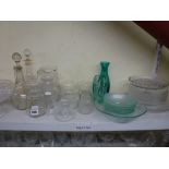 Two shelves of mixed glassware including cut glass wine glasses, sherry glasses, bon bon dishes,