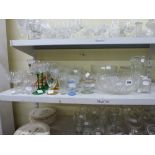 A quantity of glassware, including a set of green stemmed hock glasses, a cake plate, fruit bowls,