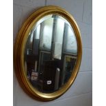 An oval gilt framed bevelled edge mirror. WE DO NOT ACCEPT CREDIT CARDS. CLEARANCE DEADLINE IS