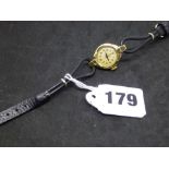 A Tudor 9 ct gold lady's wrist watch, on black leather cordette strap, Chester hallmark for 1956