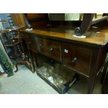 A good quality mahogany dressing table of three drawers cross-banded in stained wood to match the