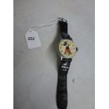 A vintage Ingersoll Mickey Mouse wrist watch, lacking bezel, on probably original leather strap with