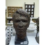 A Polish heavy bronze head of a young man, attributed to Ihnatowicz, apparently unsigned, on