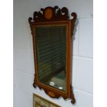 An Edwardian mahogany framed bevelled edge mirror with inlaid decoration and beadwork. WE DO NOT