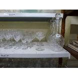 A suite of etched glasses comprising: pair of decanters and stoppers, six champagne saucers, six