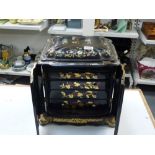 An impressive Victorian inlaid and painted papier-mache cabinet with workbox beneath the hinged