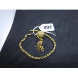 A 15 ct gold watch guard, with engraved ball pendant and tassel, 17.1 gm WE DO NOT ACCEPT CREDIT