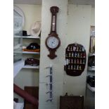 A wooden cased Admiral Fitzroy Indicator aneroid barometer, a brushed metal coat rack and a wooden