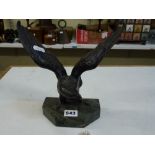 A bronze figure of an eagle with wings outstretched, on marble base, apparently unsigned, 22.5 cm