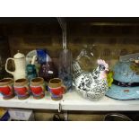 A quantity of decorative glassware including a hat, jug, two Caithness etched vases, a blue overlaid