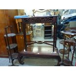 A Chinese low table of classical form with carved frieze and an English mahogany hall table with