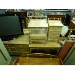 A good quality modern bedroom suite in limed wood, of nine-drawer chest, dressing table of two