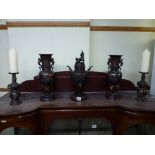 An oriental bronzed garniture comprising of a koro and lid and two vases plus a similar pair of