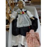 A Lenci felt doll with blonde hair and blue eyes, 34 in tall, in original black silk dress with